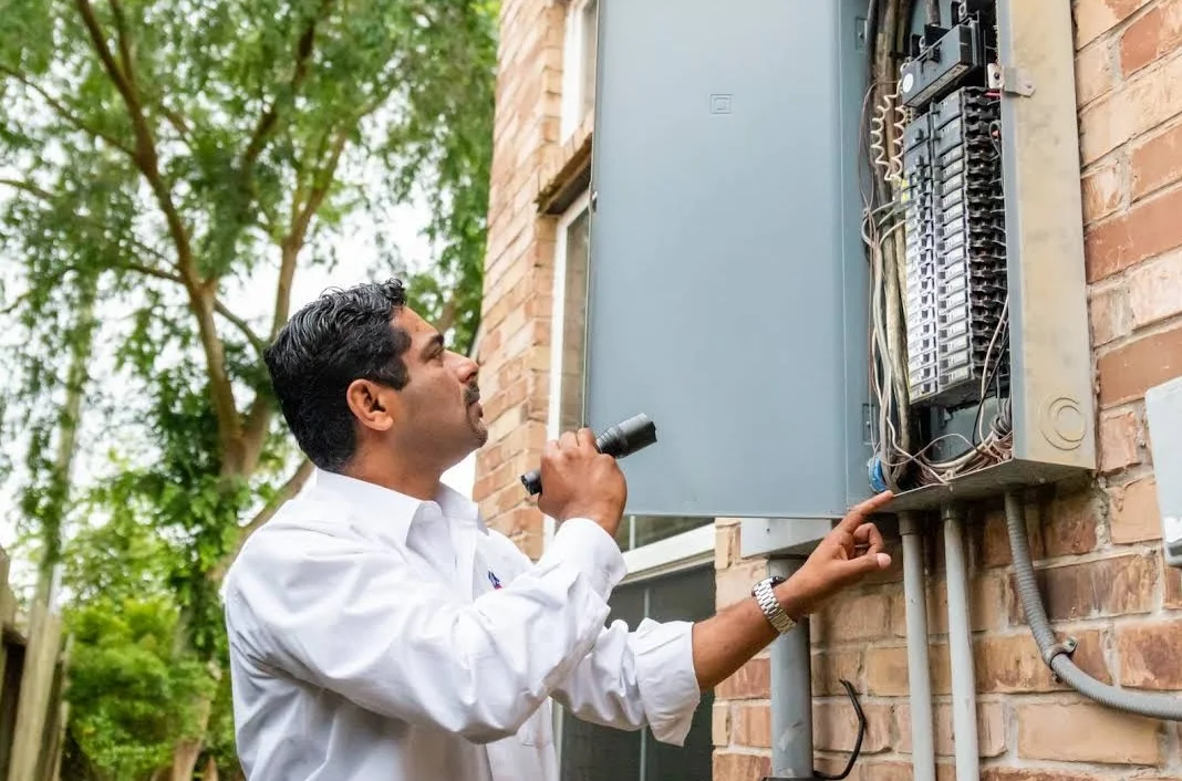 Alex Mathew on site checking a residential electrical panel